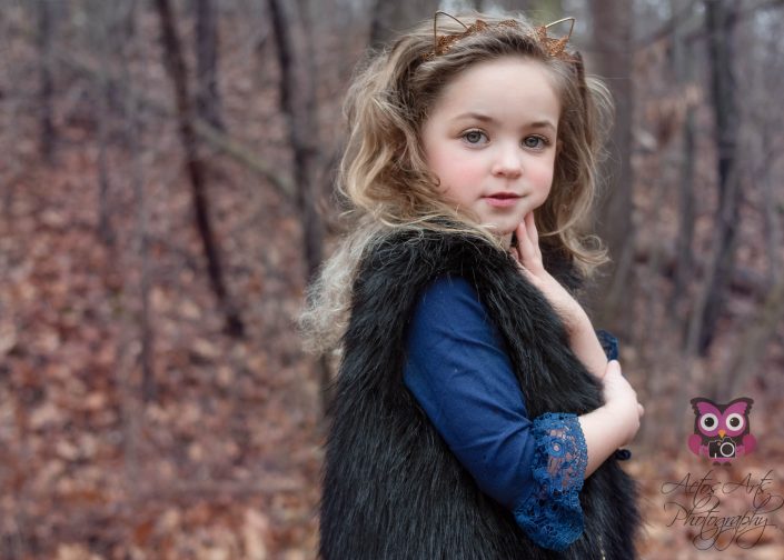 Gorgeous Child poses in the winter woods