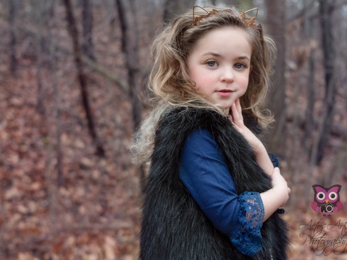 Gorgeous Child poses in the winter woods