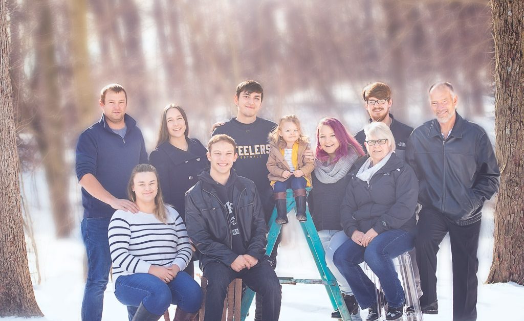 Large Family poses in the winter woods