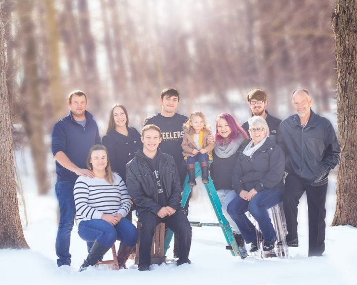 Large Family poses in the winter woods