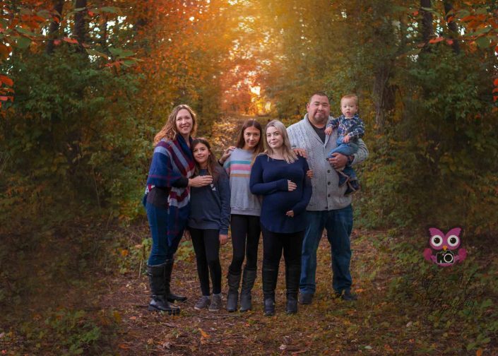 beautiful family in the fall woods