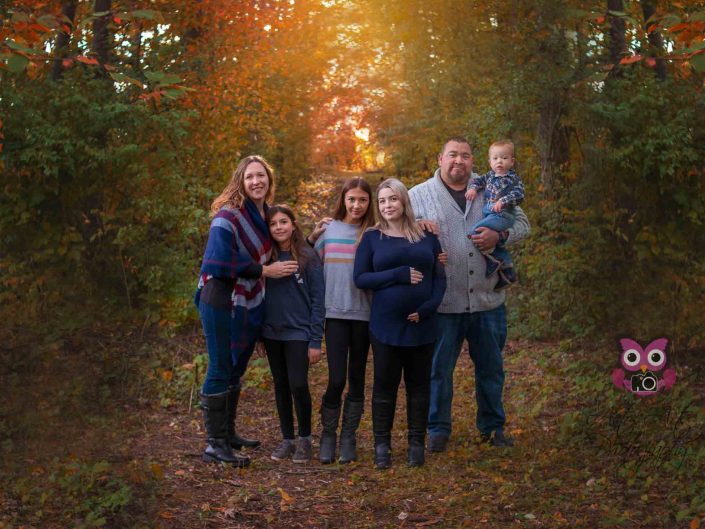 beautiful family in the fall woods