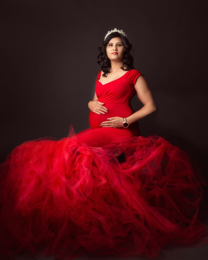 Elegant mother poses in studio