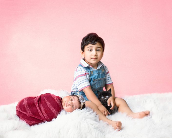 Darling siblings pose together at newborn session